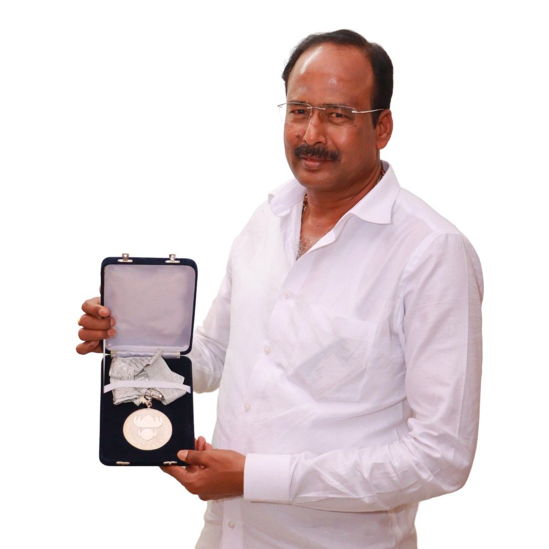 Ramesh Reddy Holding National Award Medal